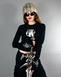 Chaos Longsleeve Tee - Thumb Holes & Silver Embroidery styled with fur hat and sword. Features cropped fit and gothic silver detailing on sleeves and chest.