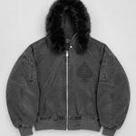 A dark gray washed cotton aviator jacket with a black faux-fur trimmed hood, featuring a tonal black spade logo on the left chest and a silver front zipper.